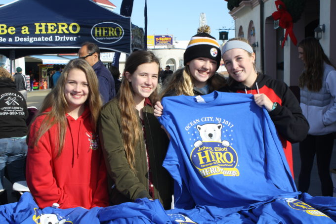 HERO Campaign volunteers show off the 2017 Plunge commemorative T-shirt.